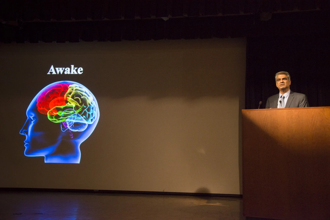 outreach event, presenter in front of projector